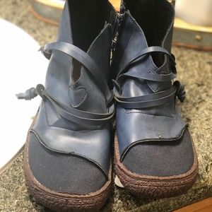 Flat blue faux leather boots with rubber soles